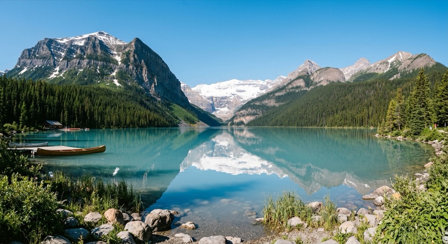 Calm mountain lake under a clear sky, before edit